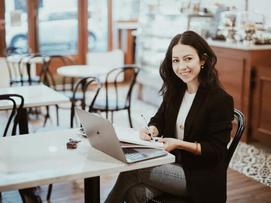 the Sunday edit woman working from a coffee shop fashion blogger working from home